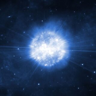 كرة تُضيئ باللون الأبيض ويخرج منها خيوط بيضاء رفيعة في وسط الظلام