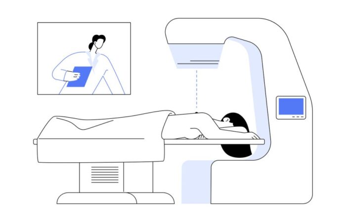 رسم توضيحي لفتاة مستلقية على بطنها على سرير جهاز طبي يقوم بتصويرها من الأعلى