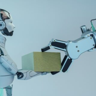 ذراع آلية تقوم بمناولة صندوق مربع لرجل آلي